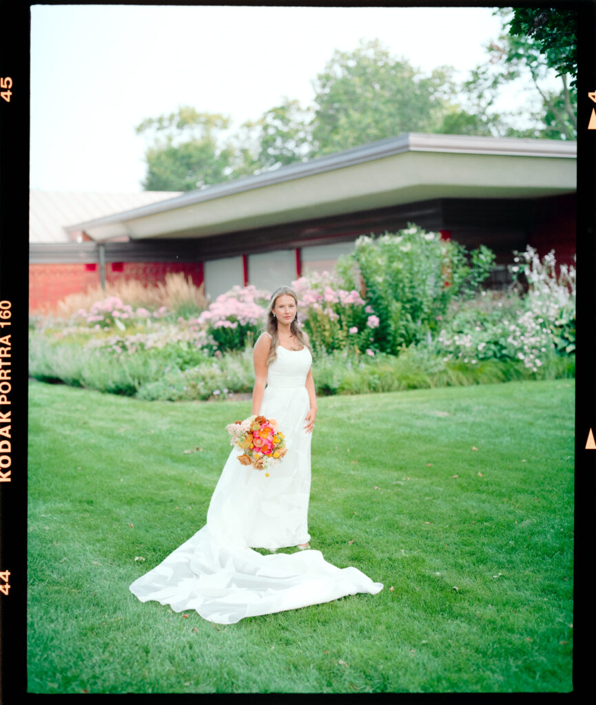 Bride standing with bokeh in film photo