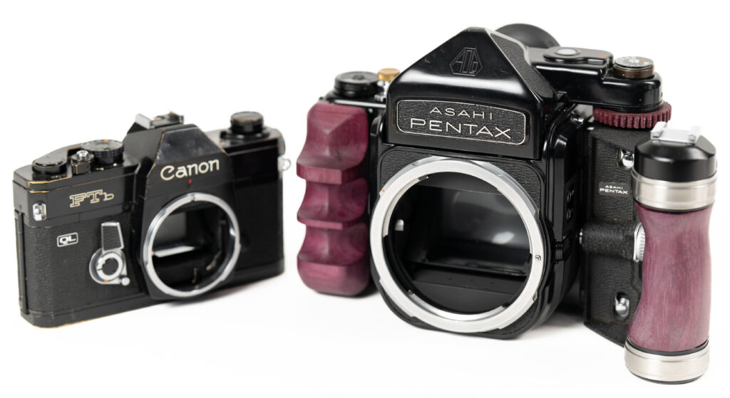 pentax 6x7 film camera on display with another camera alongside it